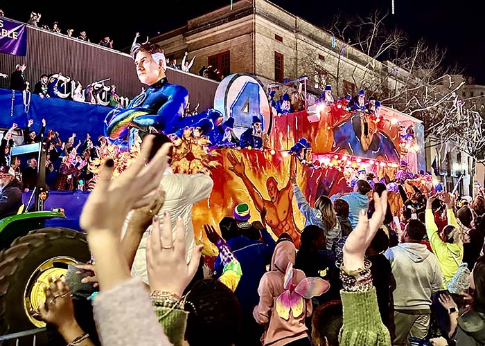 A vibrant image of a Mardi Gras parade in New Orleans, featuring colorful floats, masks, and bead-throwing.